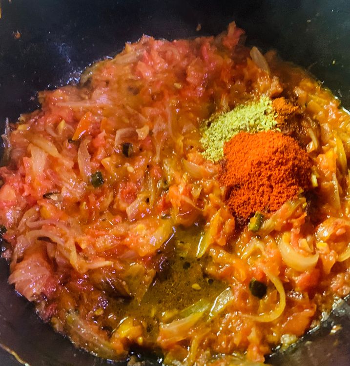Step 1.1: Now add red chilli powder, Kashmiri red chilli powder, coriander powder and salt and mix nicely for another minute till oil separates from the mixture and leaves the sides of the pan