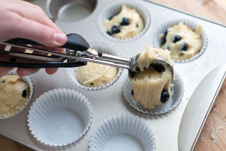 Step 2.1: Pipe the mixture into muffin molds or cups, filling them about 70% to 80% full