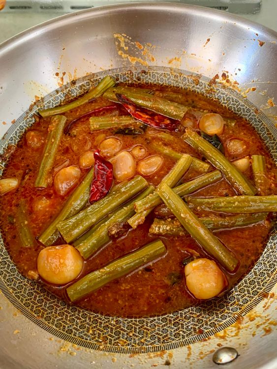 Step 1.1: Add the boiled drumsticks to the pan and mix well