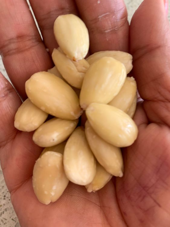 Step 1.1: Soak the almonds in hot water for 10-15 minutes, then peel and grind them to a fine paste with little milk or water