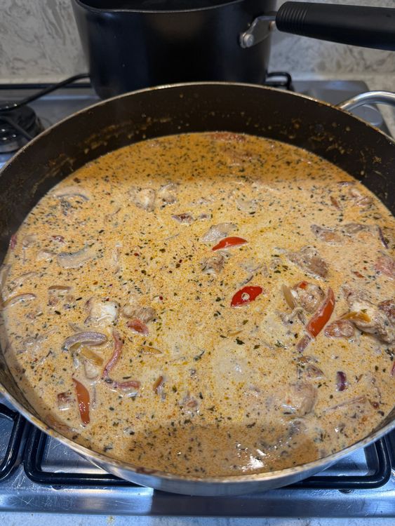 Step 3.1: Add the chicken stock cube, cream soft cheese and reserved pasta water