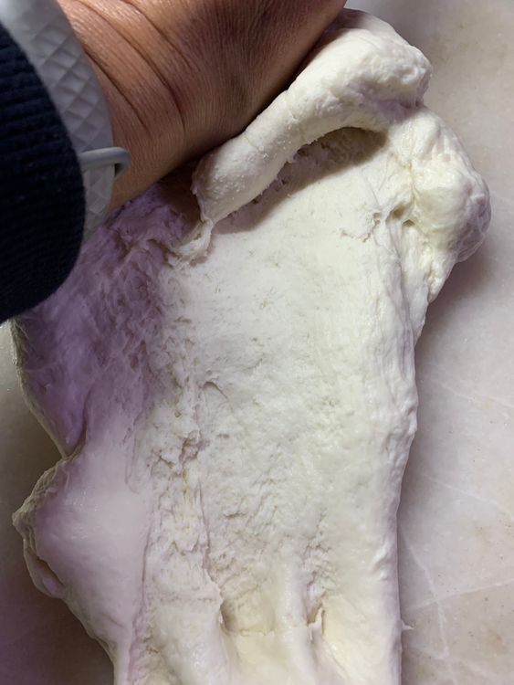 Step 1.2: Pour 1 tbsp of oil and knead again for 3-4 minutes until it is smooth and elastic