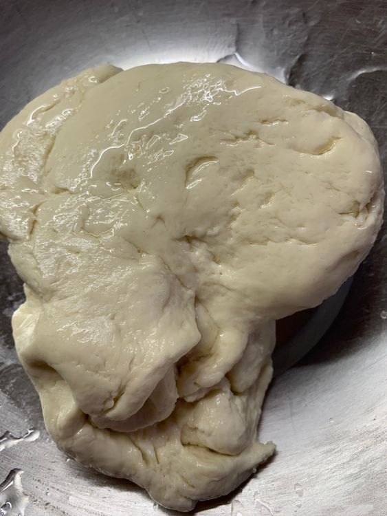 Step 1.1: Pour 1 tbsp of oil and knead again for 3-4 minutes until it is smooth and elastic