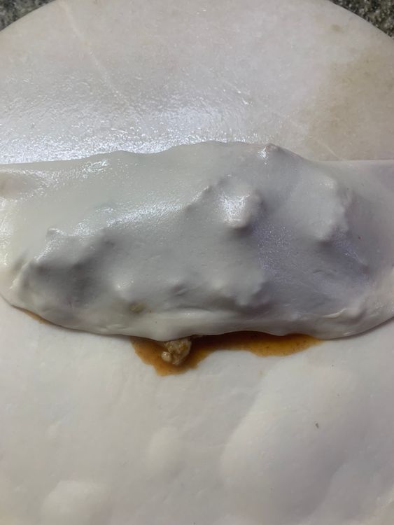 Step 3.1: Now fold the dough over the filling to form a square or a rectangular pocket, pressing the edges together to seal the filling inside