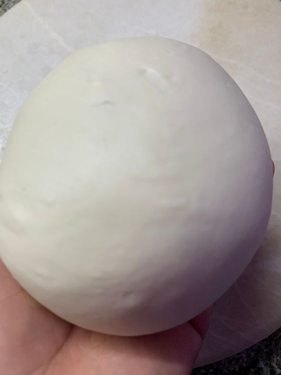 Step 1.3: Pour 1 tbsp of oil and knead again for 3-4 minutes until it is smooth and elastic