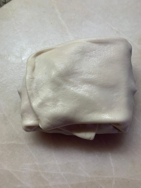 Step 3.2: Gently place the dough pocket into the hot oil and shallow fry for about 3-4 minutes