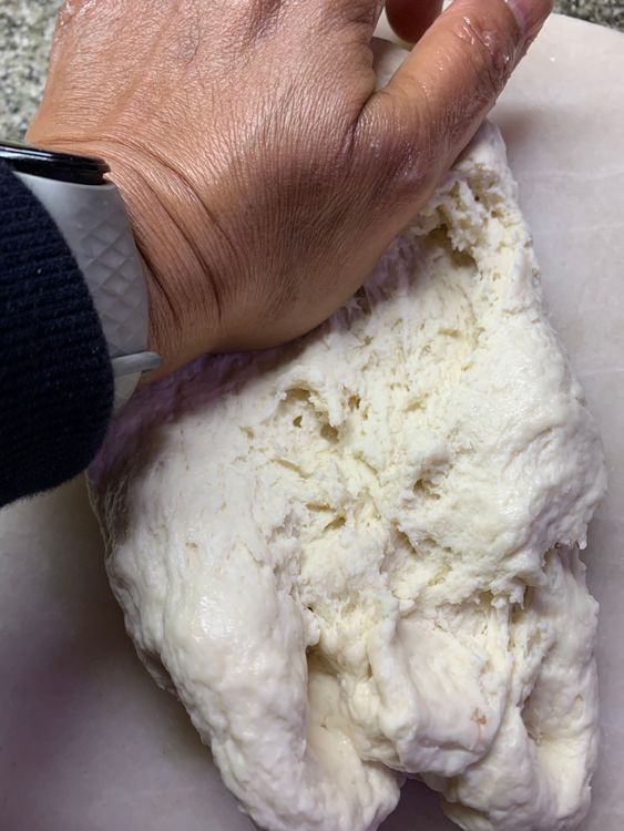 Step 1.2: Pour 1 tbsp of oil on the dough