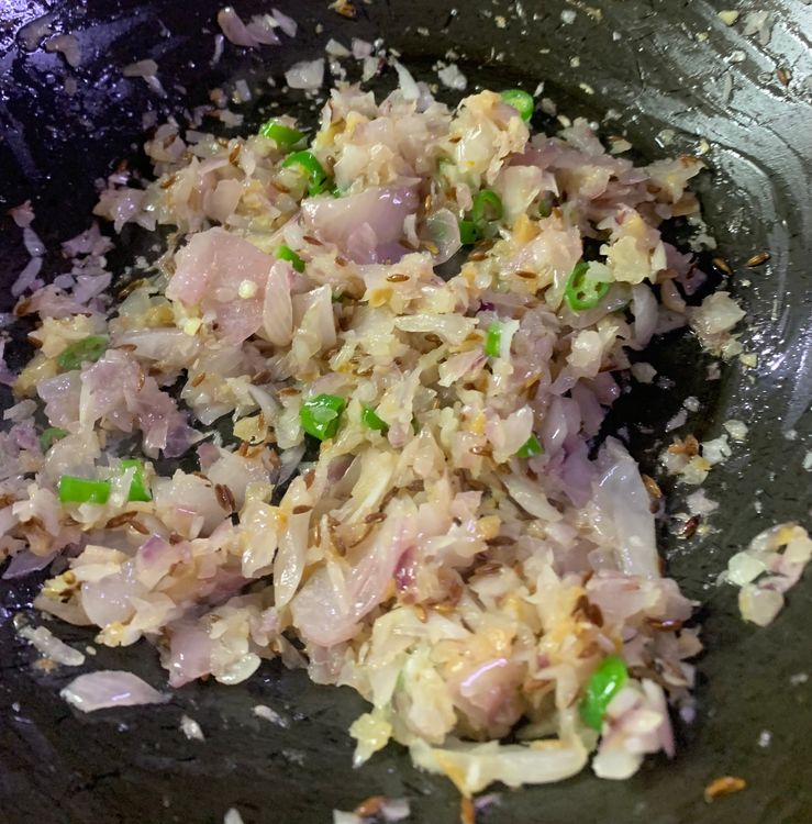 Step 2.1: Add the chopped onions, and green chilies and cook for 3-4 minutes until translucent