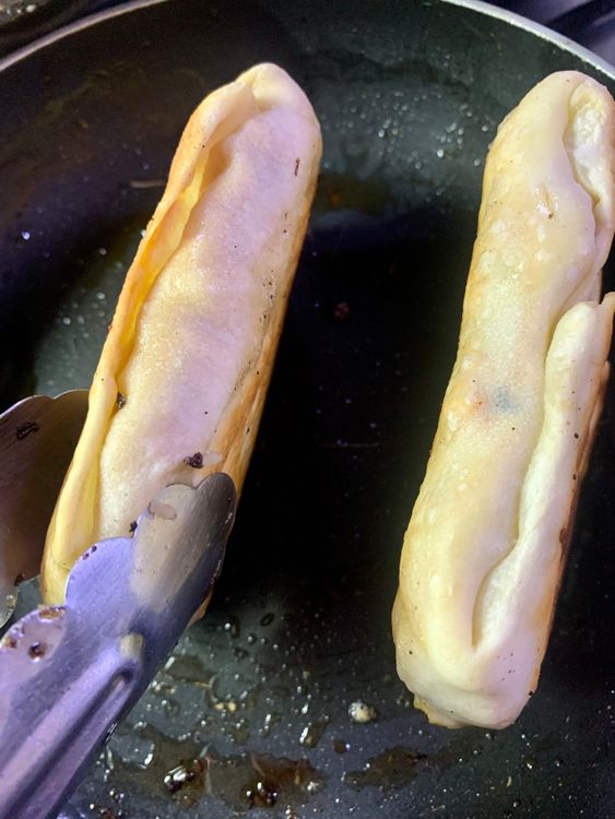 Step 3.5: Carefully flip the dough pocket with a spatula and continue frying for another 3-4 minutes, or until the dough pocket is  is golden brown and crispy from all sides