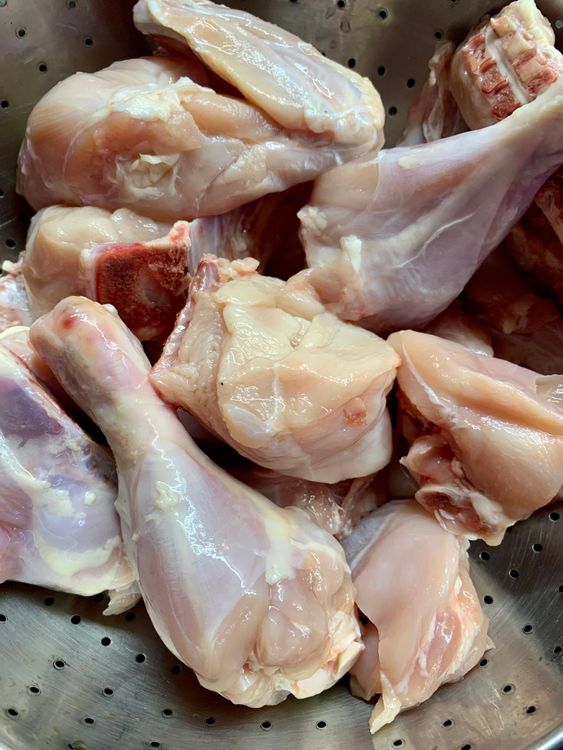 Step 1.1: Wash the chicken pieces and drain out the excess water