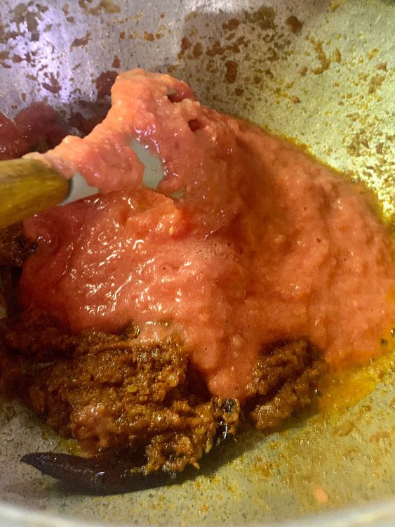 Step 1.1: Now mix in the ground tomatoes and cook for another 3-4 minutes