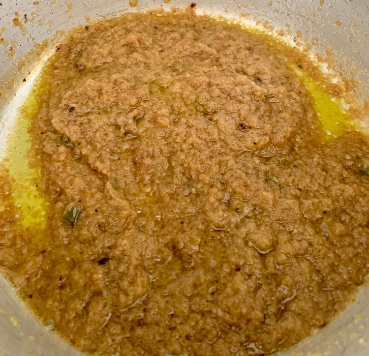 Step 3.2: Add ground onions and green chillies and cook until golden brown by stirring frequently or until oil releases to the surface