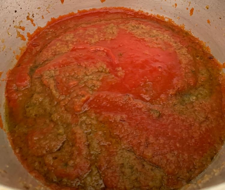 Step 3.1: Add tomato puree and cook for 3-4 minutes till oil releases to the surface and leaves the sides of the pan