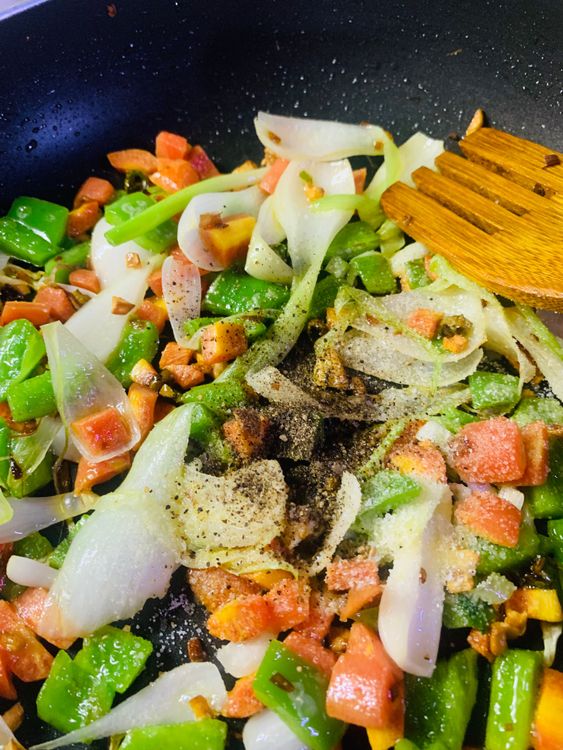 Step 2.1: Add black pepper, salt, white pepper, oregano, soy sauce and vinegar and stir on medium to high flame for a minute