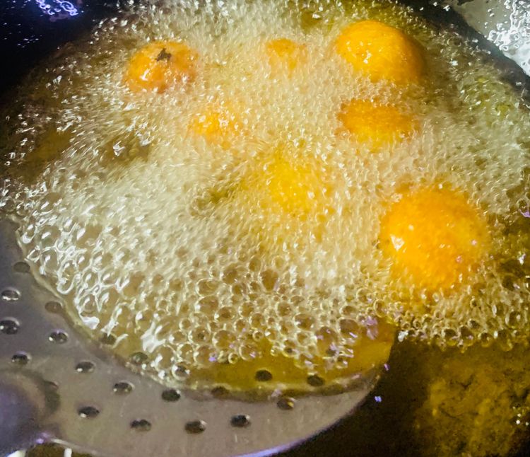 Step 1.2: Add potato balls to the oil in small batches