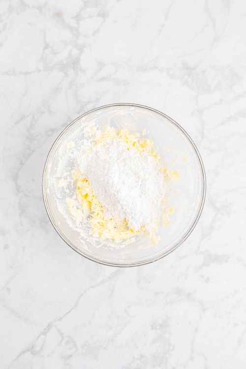 Step 1.1: In a large bowl, mix the butter, corn syrup, and almond extract together until smooth and well combined
