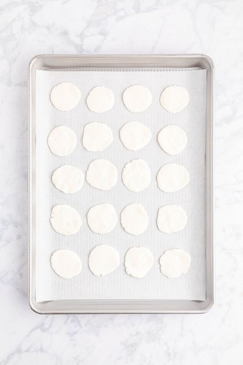 Step 1.1: Pinch off ½ tablespoon-sized pieces of dough, roll into a ball, and then flatten the balls into discs