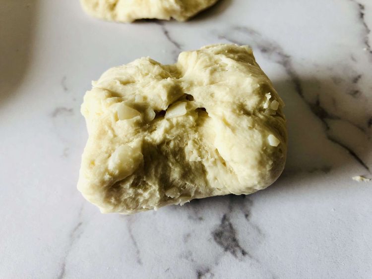 Step 1.1: Pinch each biscuit half up to the center and roll it into a ball