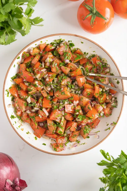 Step 5.1: Allow the salad to sit for a few minutes to let the flavors meld, then serve immediately as a refreshing side dish