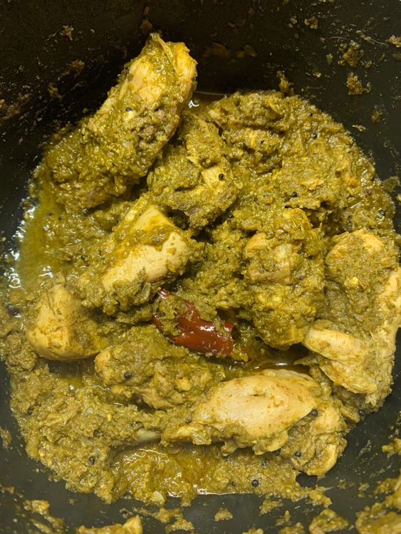 Step 2.3: Once the chicken pieces have lightened in colour, add curd, stir and wait for a boil
