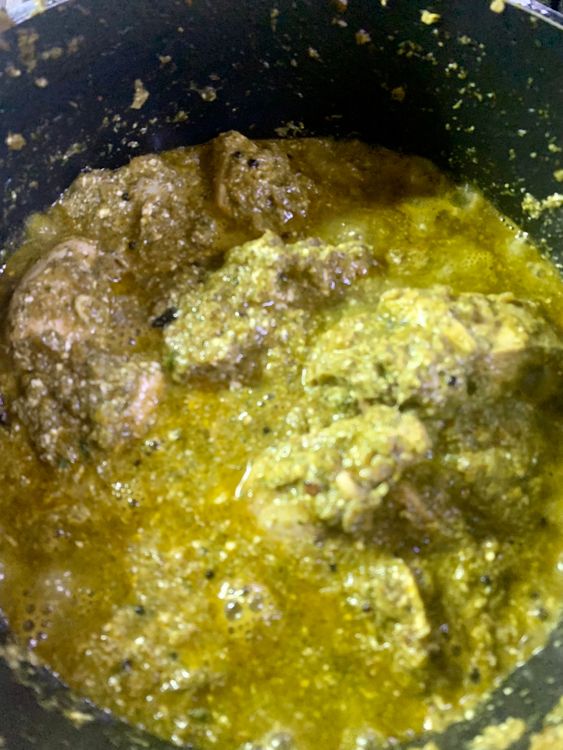 Step 2.2: Once the chicken pieces have lightened in colour, add curd, stir and wait for a boil