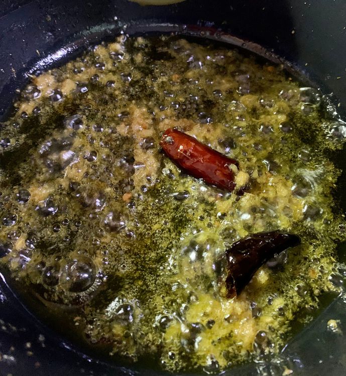 Step 2.1: Add ginger-garlic paste and stir for a few seconds until slightly brown