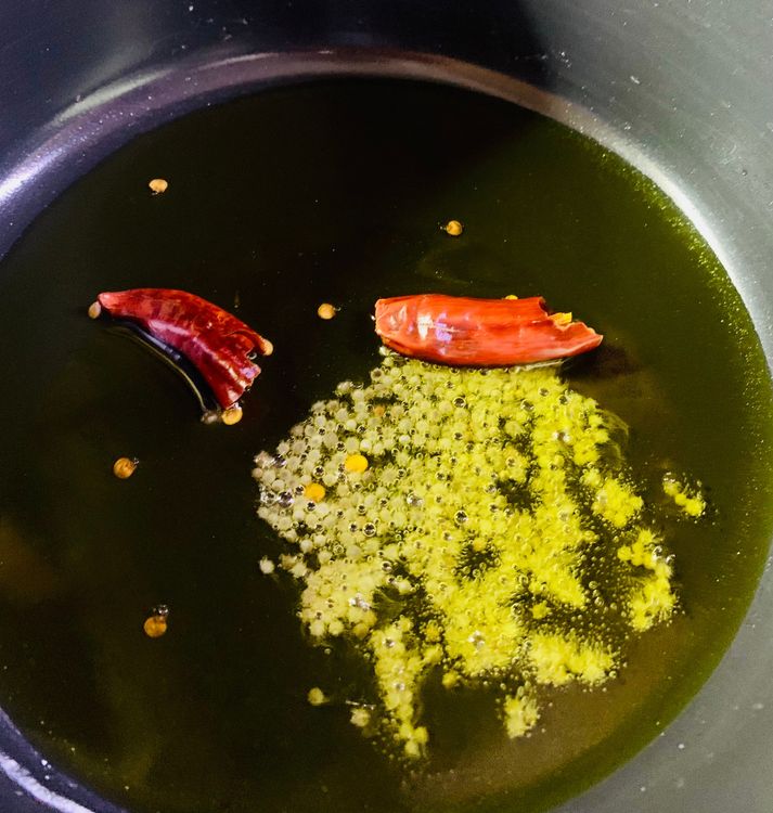Step 2.1: Heat oil in a heavy-bottomed wok or deep pan over medium-high heat until it shimmers