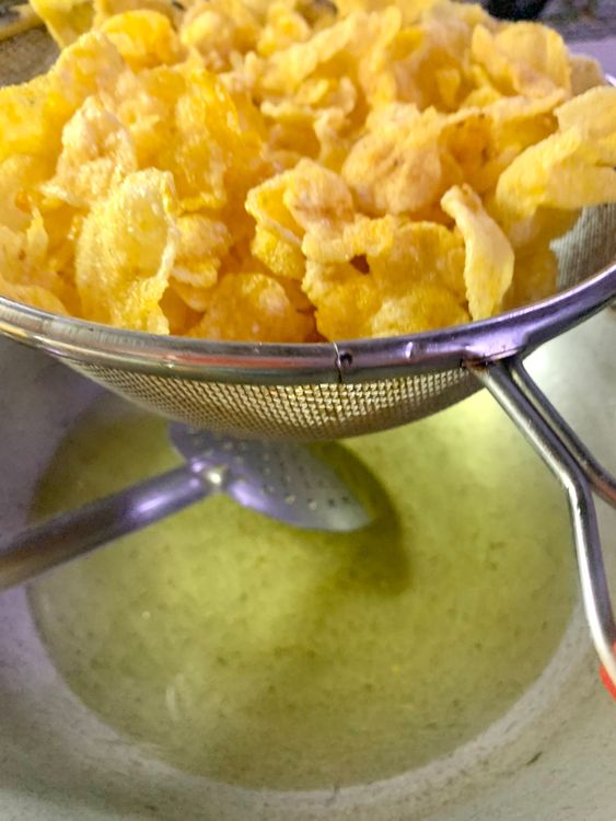 Step 2.1: Remove them using a slotted spoon and place them on a sieve to remove excess oil
