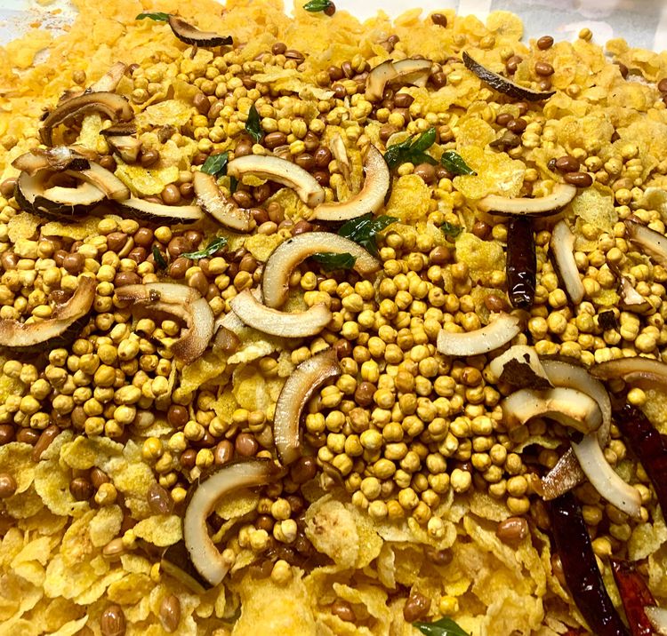 Step 2.8: Repeat the same process for the peanuts, roasted channa, dried coconut, dry red chillies and curry leaves