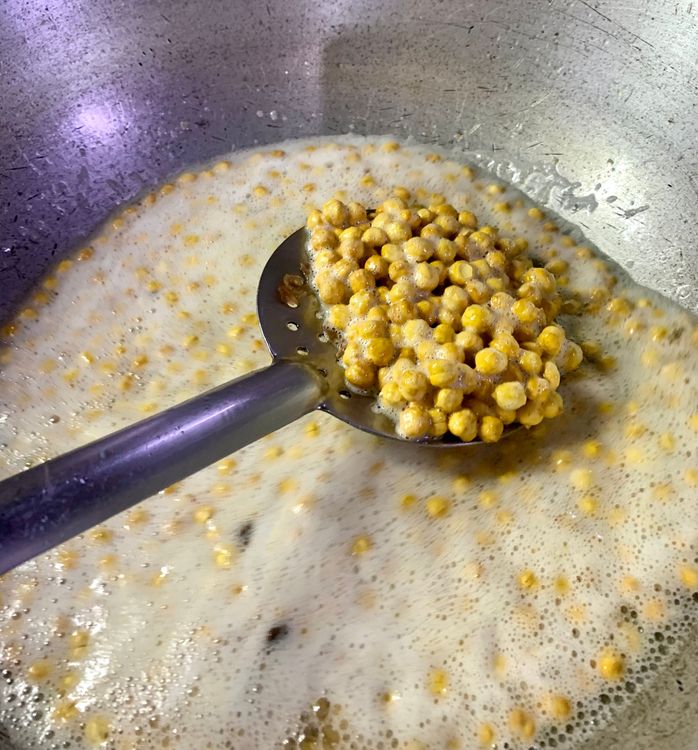 Step 2.4: Repeat the same process for the peanuts, roasted channa, dried coconut, dry red chillies and curry leaves