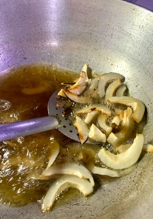 Step 2.7: Repeat the same process for the peanuts, roasted channa, dried coconut, dry red chillies and curry leaves