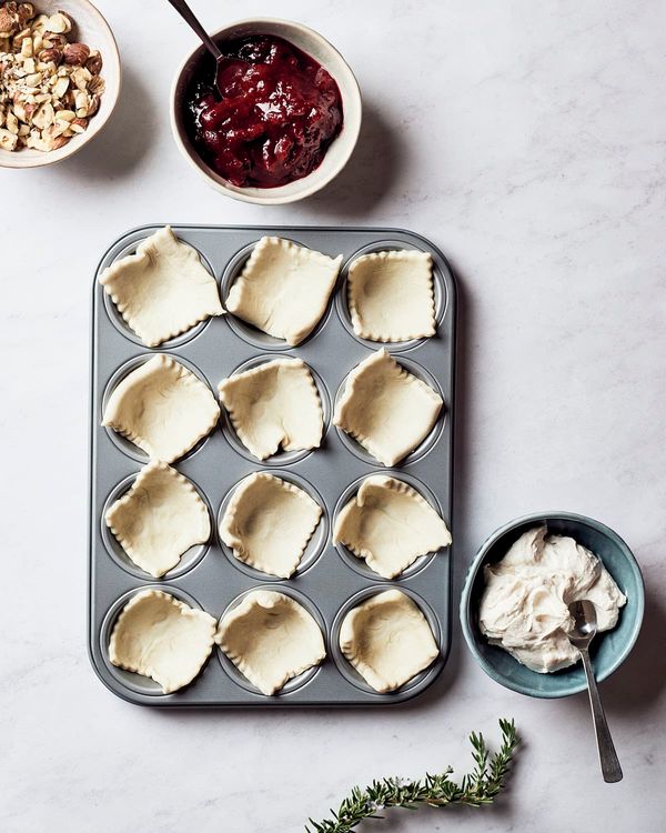 Step 1.1: Roll out the puff pastry on parchment paper and cut it into 16 squares