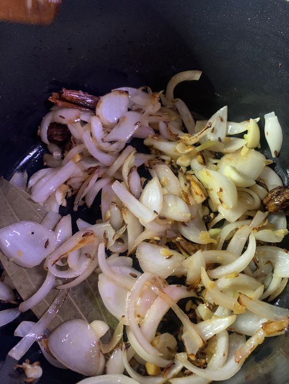 Step 2.1: Add the ginger and garlic pastes and stir for a minute or until the raw smell disappears