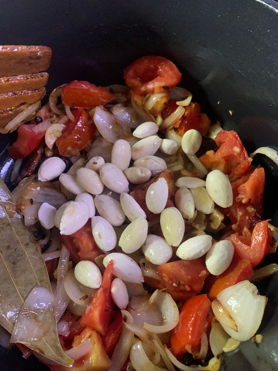 Step 2.1: Now add the deskinned almonds and stir to combine
