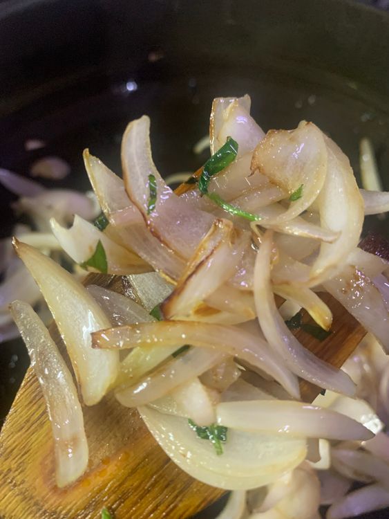 Step 2.1: In the same pan, heat 1 tbsp oil and add the sliced onions