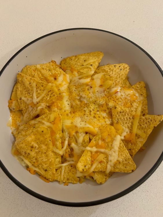Step 3.1: Sprinkle shredded cheese over the chips and microwave for 30 seconds to 1 minute, or until the cheese is melted
