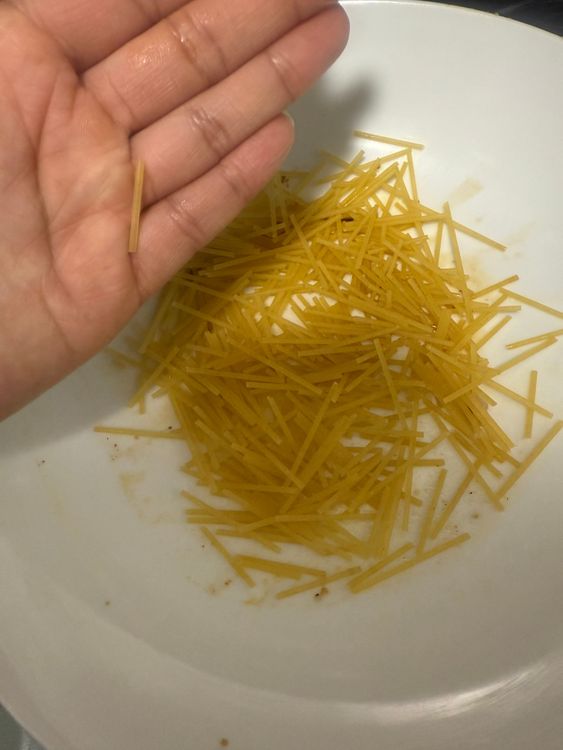 Step 3.1: Break the noodles into small pieces and add them to the soup pot