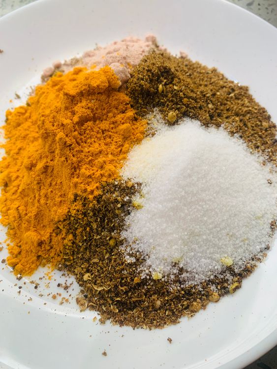 Step 1.1: Mix the spice powder, black salt, turmeric powder, and salt in a large bowl