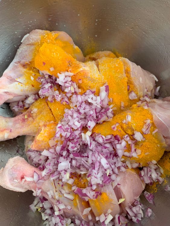 Step 1.1: Add lemon juice, turmeric powder, salt, and the finely chopped onion to the bowl