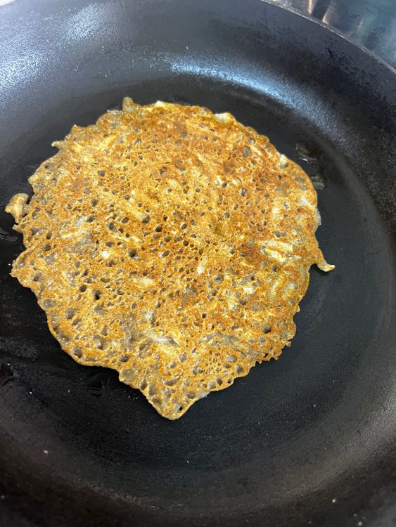 Step 1.2: Pour a little ghee and cook from both sides until golden brown