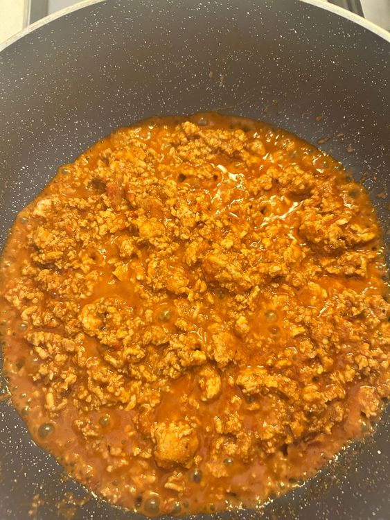Step 1.1: Add the minced chicken to the skillet