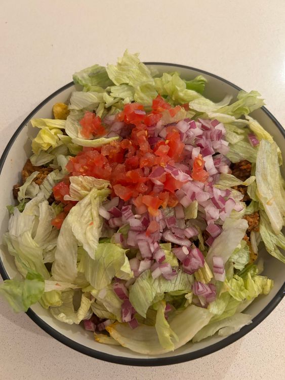 Step 3.2: Sprinkle diced onion, tomato, lettuce and cilantro for freshness