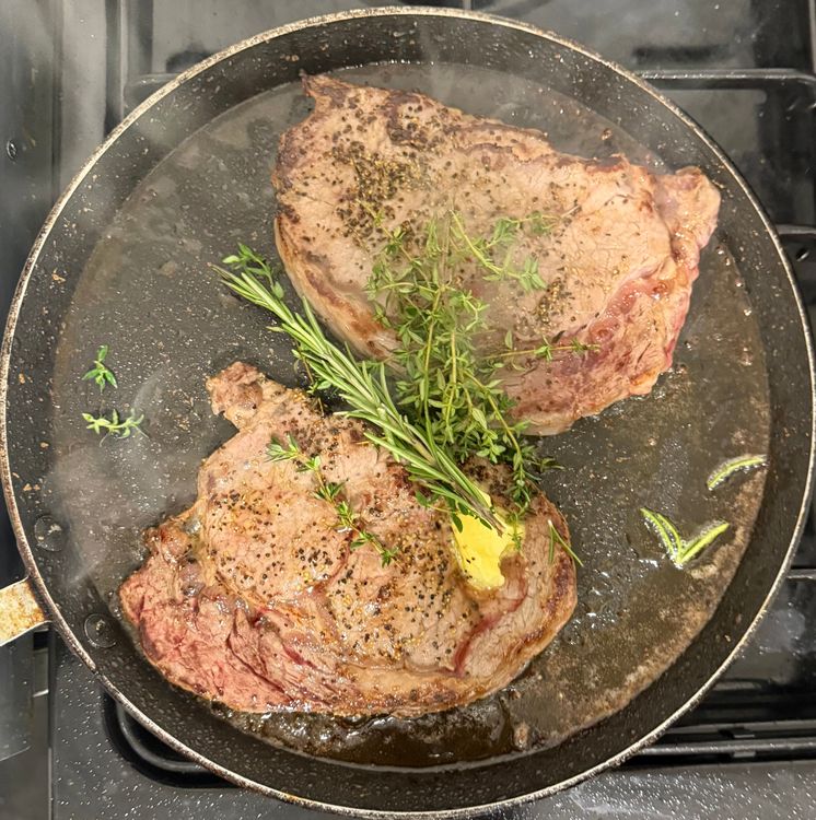 Step 2.1: Reduce the heat to medium, add another knob of butter, fresh rosemary, and fresh thyme