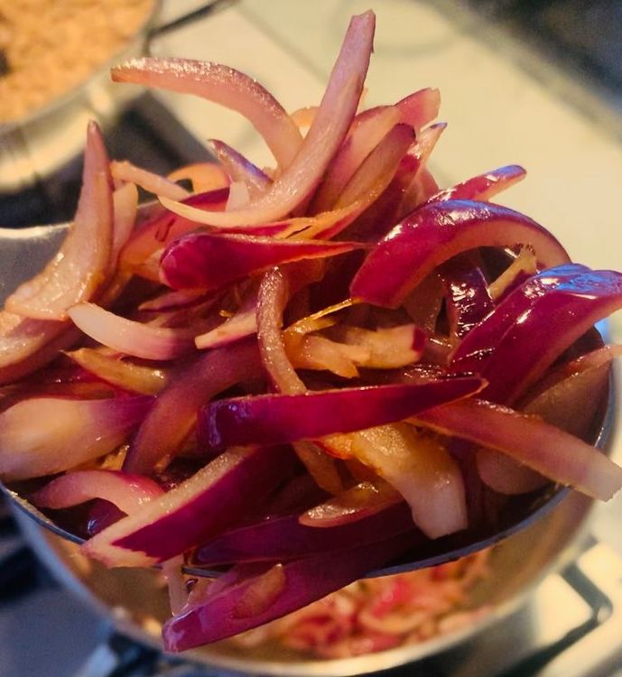 Step 1.2: Add another teaspoon of oil to the pan and add the sliced onions