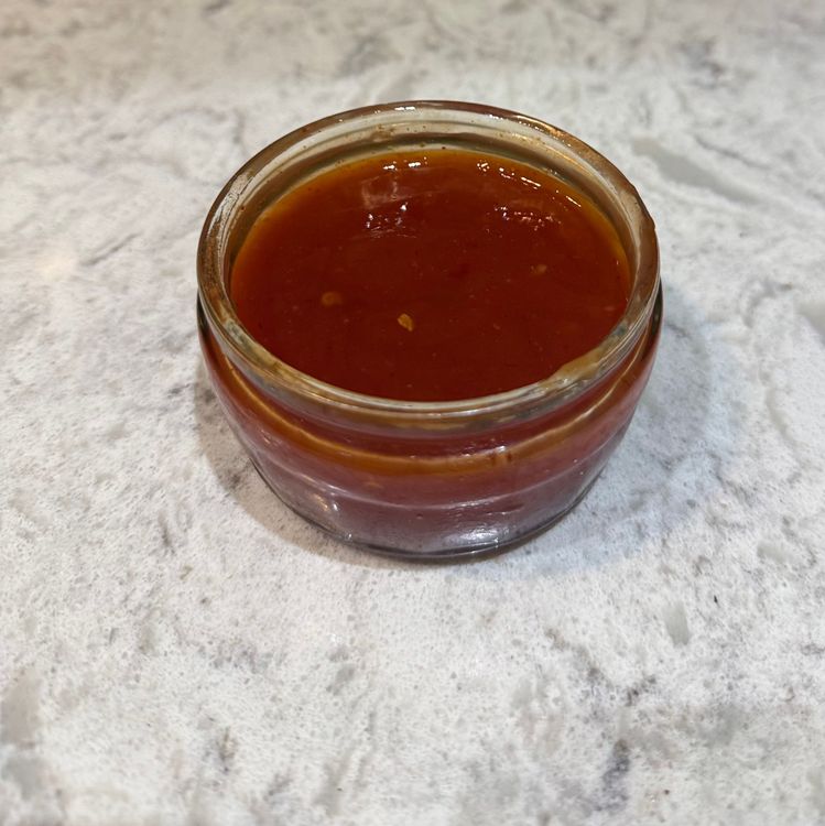 Step 2.1: While the chicken is cooking, mix sweet chilli sauce, ketchup, lemon juice, water, and hot sauce in a small bowl