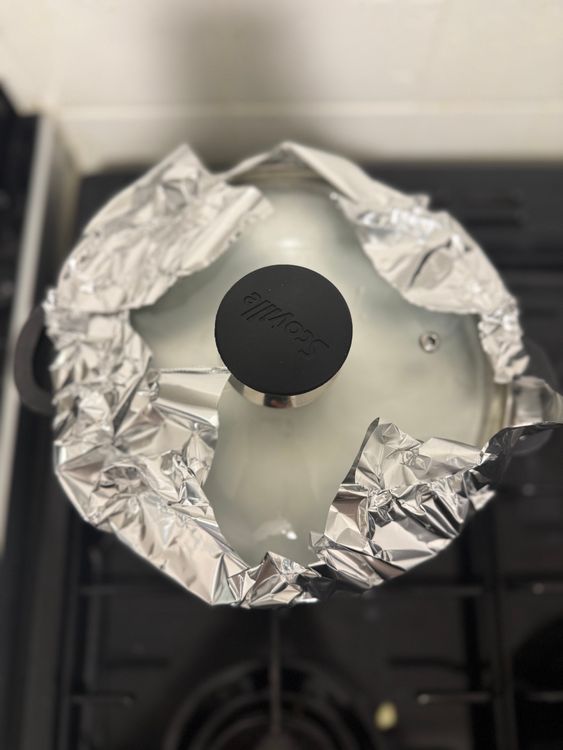 Step 3.1: Turn off the heat, cover the pot with tin foil, and secure the lid to allow the rice to steam for 8 minutes