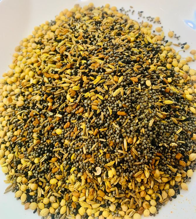 Step 1.2: In a dry pan, roast the mustard, fennel, coriander, cumin, nigella, fenugreek, and carom seeds for a few minutes until fragrant