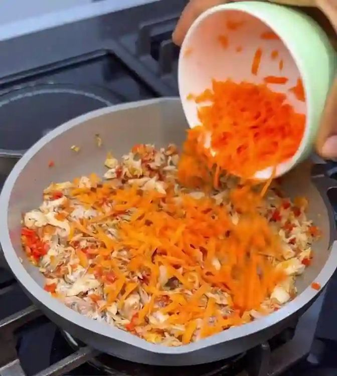 Step 1.1: Add mashed fish, grated carrot, and a little water used in cooking the fish