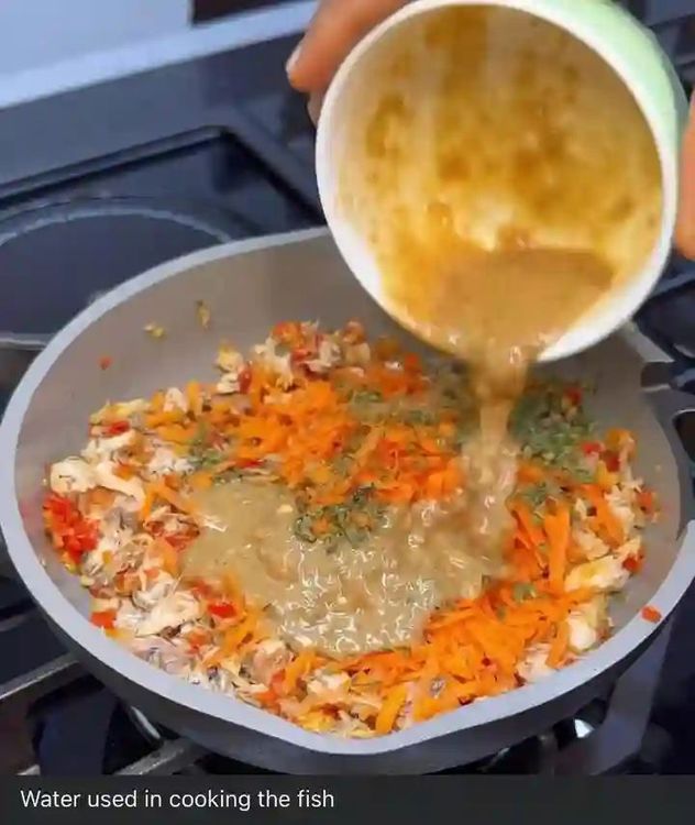 Step 1.2: Add mashed fish, grated carrot, and a little water used in cooking the fish