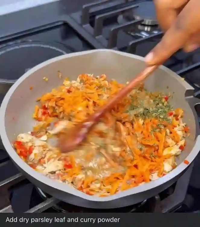 Step 1.3: Add mashed fish, grated carrot, and a little water used in cooking the fish